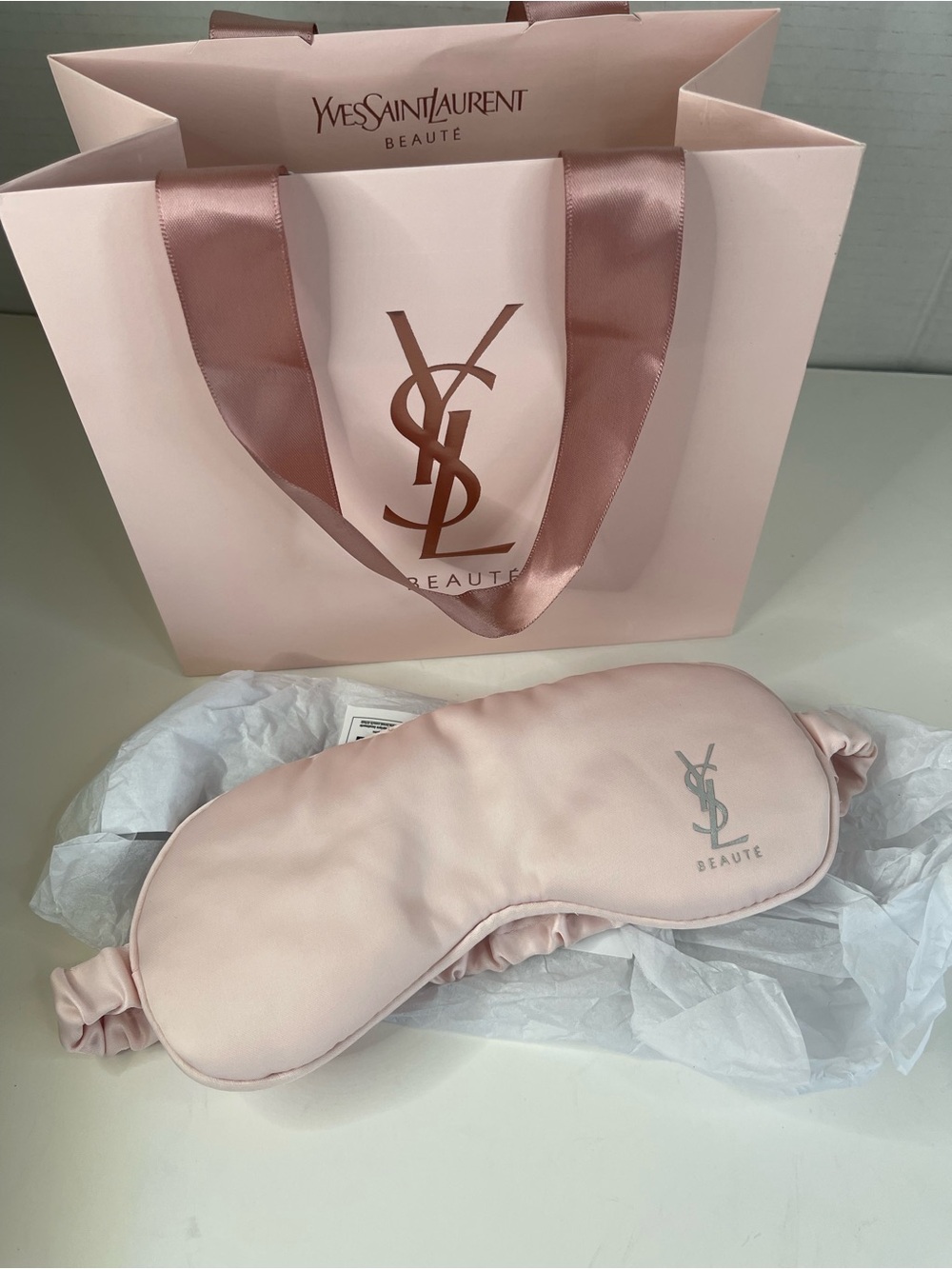 Yves Saint Laurent silk sleep mask with shopping bag